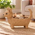 Cat-shaped water hyacinth basket holding cat toys in a living room