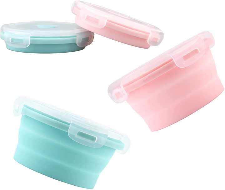 Collapsible pet bowls with lids shown in pink and mint