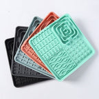 Textured silicone lick mats shown in three colors