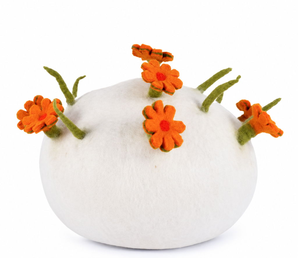 White round wool cat cave with orange felt flowers, rear view