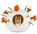 White round wool cat cave with orange felt flowers, front view