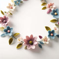 Garland of pastel felt flowers and green leaves