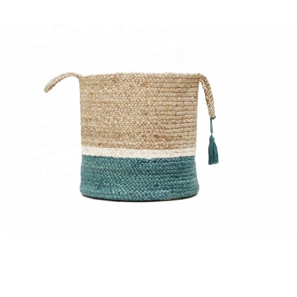 Woven storage basket with natural and teal bands and side handles