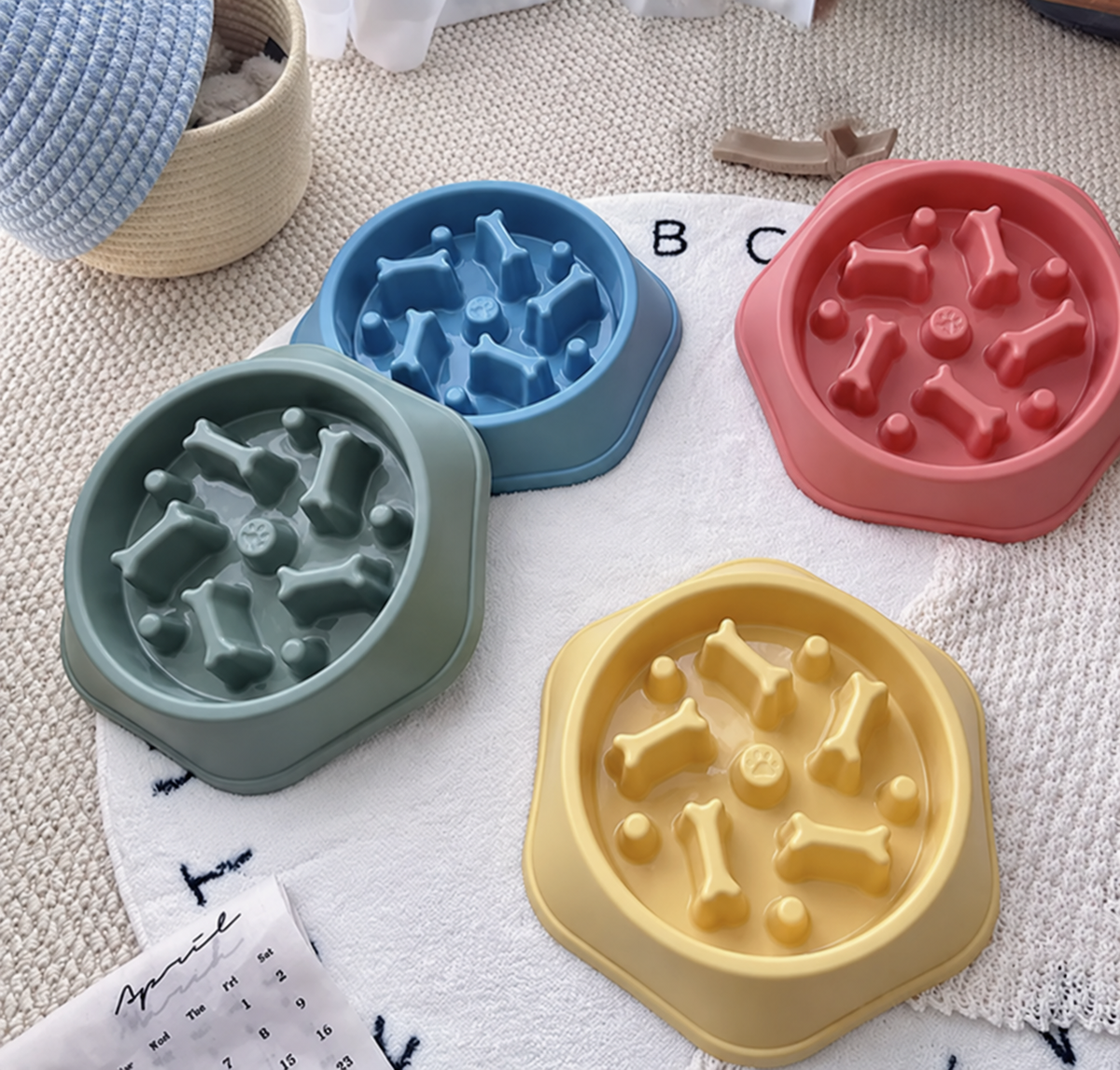 Four colors of bone-pattern slow-feeder dog bowls